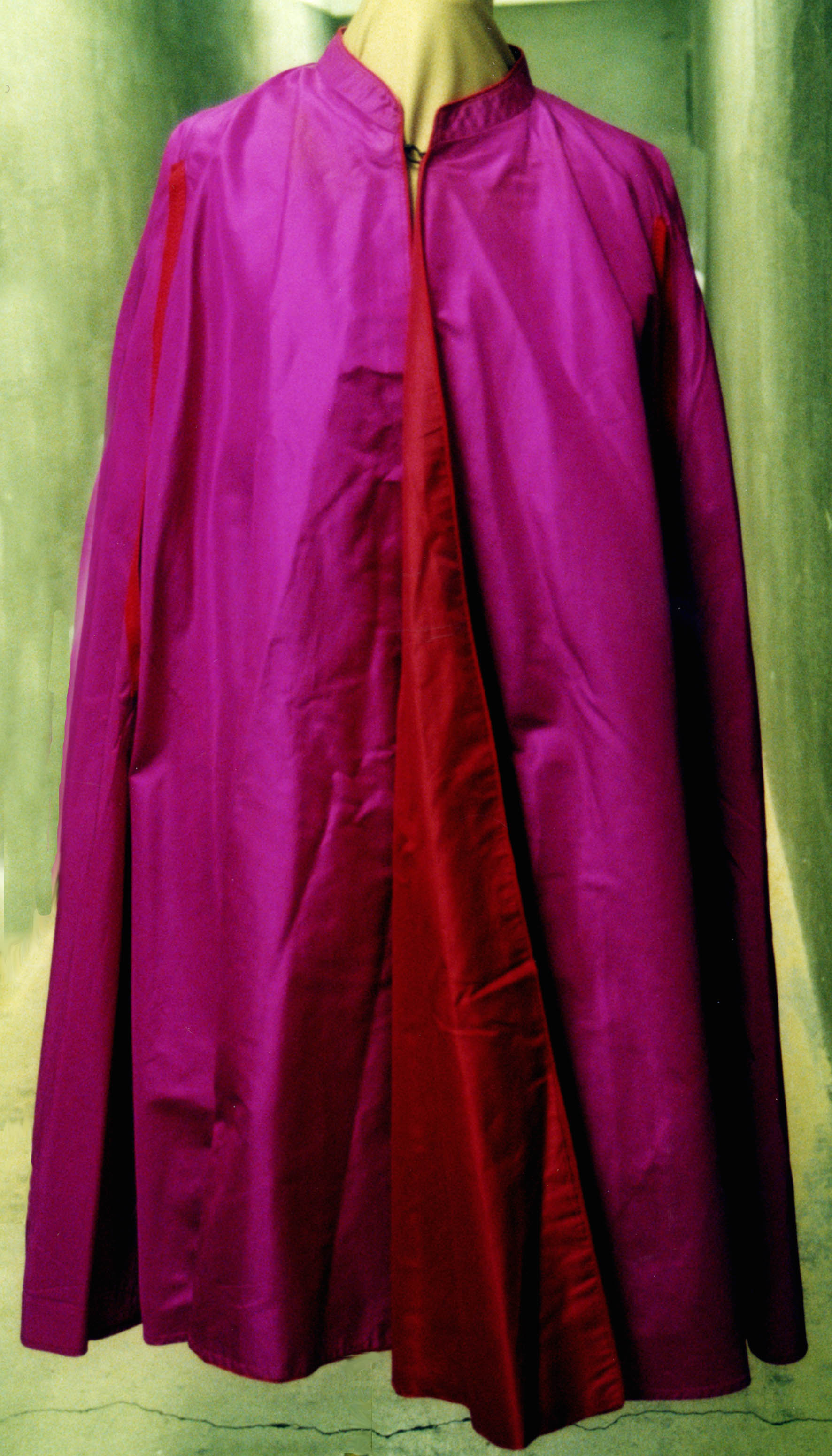 a%20maroon%20grosgrain%20fabric%20cape%20worn%20by%20Father%20Langlois